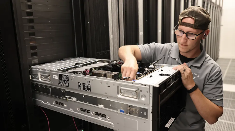 One of our data center techs pulling a GPU tray.
